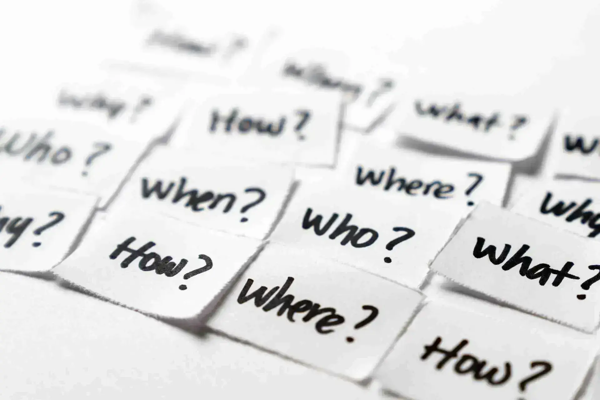 Small paper cuts with written questions on each of it.
